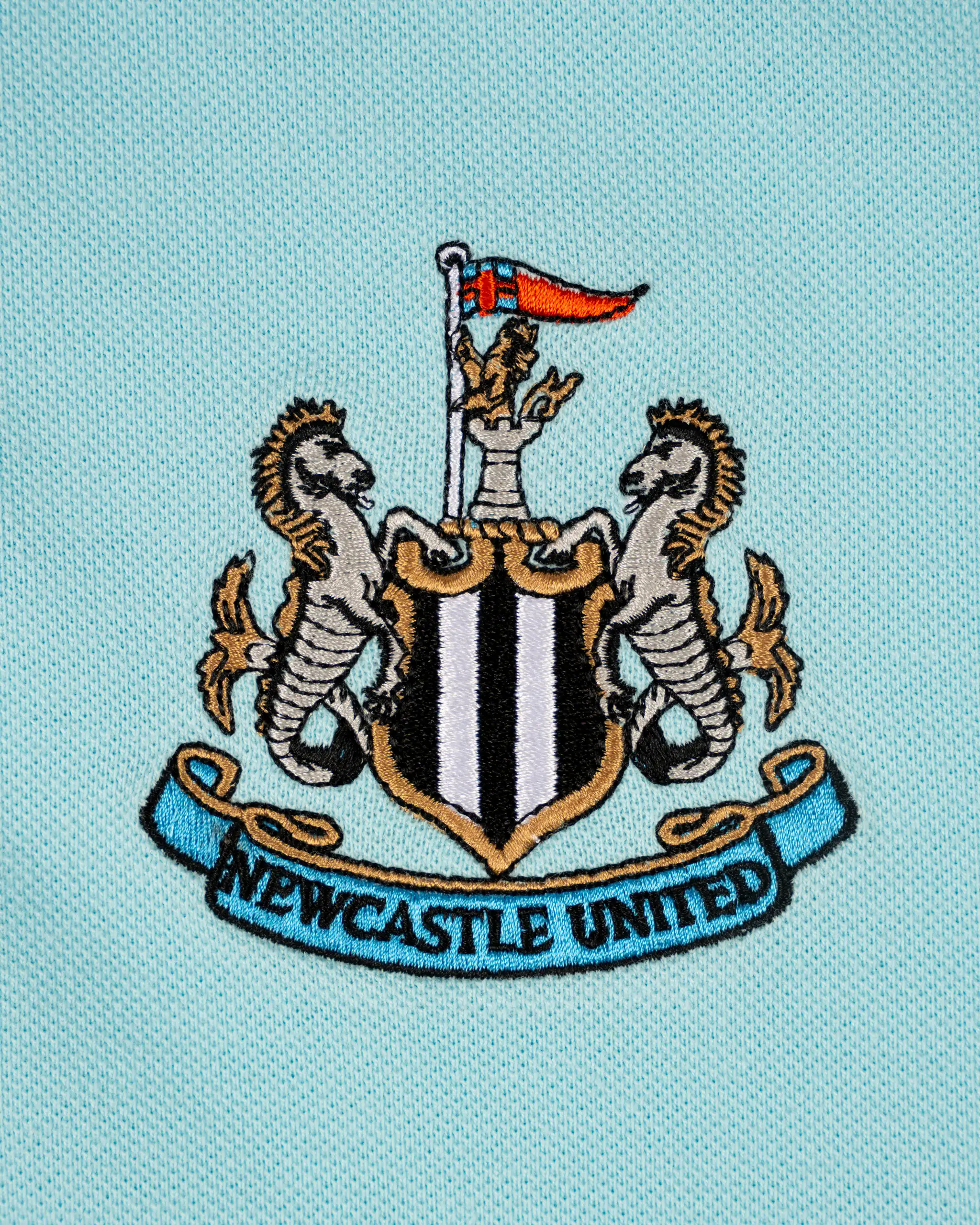 Newcastle United Kids' Essentials Range Blue Polo Shirt - Image 3